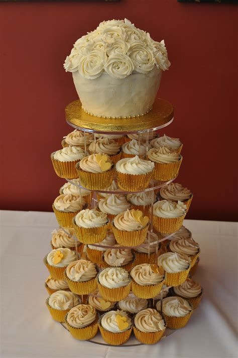 Check out our cupcake ideas selection for the very best in unique or custom, handmade pieces from our party décor shops. Gold and cream wedding with rose style giant cupcake. Butt ...