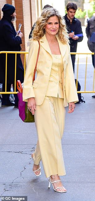 kyra sedgwick looks radiant in pastel yellow pantsuit while on promo tour for her film space