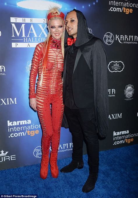 Tara Reid Shows Skin In Bright Red Jumpsuit At Maxim Party Daily Mail