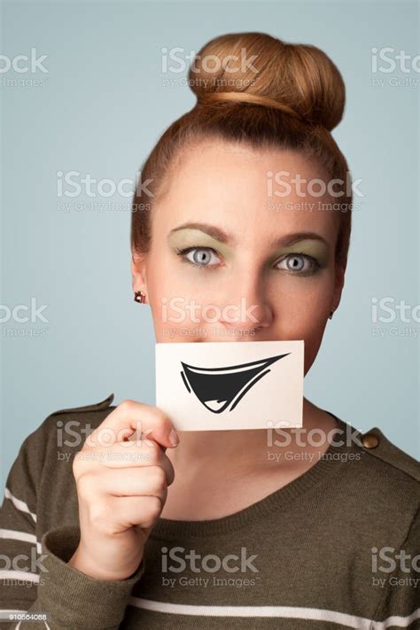 Happy Cute Girl Holding Paper With Funny Smiley Drawing Stock Photo