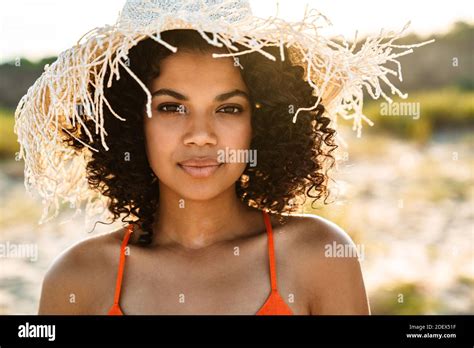 Photo Of Pretty Young African Woman Posing At The Beach Outside Stock