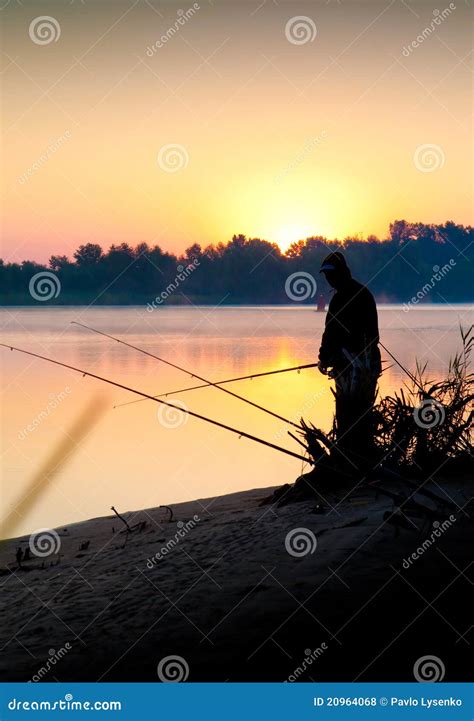 Silhouette Of Man Fishing In A Sunset Stock Photo Image Of Coastline