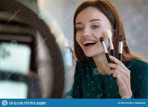 Young Woman Holding Face Brushes And Smiling Stock Image Image Of