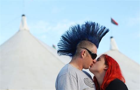Donning Brightly Colored Hair This Twosome Shared A Kiss At The Cute