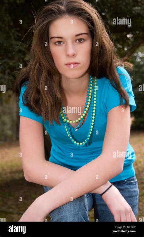 Closeup Of Pretty Caucasian Teen Girl 14 To 16 Years Stands With Arms