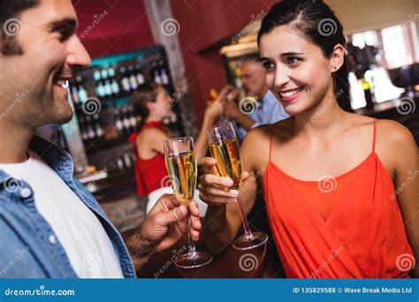 Couple Enjoying Champagne In Nightclub Stock Photo Image Of Glass