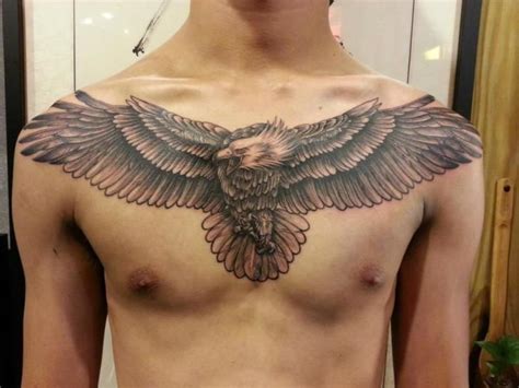 Grey Ink Open Wings Flying Eagle Chest Tattoo