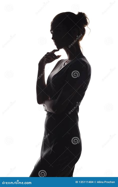 Silhouette Of A Pensive Woman With The Hand At The Chin On A White