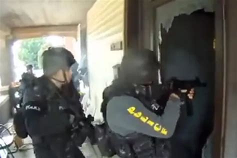 watch swat team raid gran s home after neighbour uses her wi fi to troll police world news