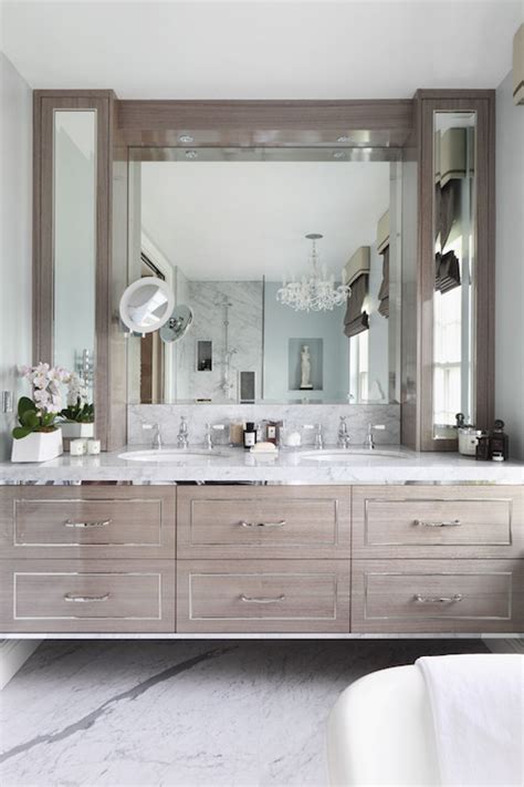 The bathroom also features a caesarstone vanity and undermount sinks by kohler; Gray Floating Vanity