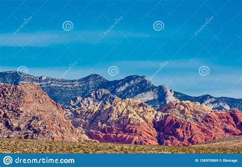 Red Rock And Blue Mountains Rising From Desert Stock Image Image Of