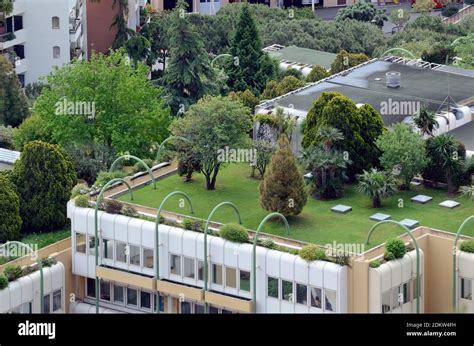 Roof Top Gardens Or Roof Garden With Lawn And Trees Atop Luxury Apartment