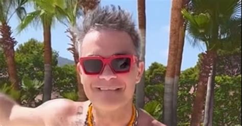 Robbie Williams Dances Shirtless As He Enjoys Lavish Ibiza Break With