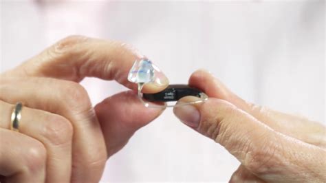 How To Place The Oticon Hearing Aid With Micro Mould On The Ear Youtube