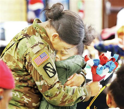 Returning Soldier Surprises Daughters At Altons West Elementary School