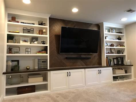 Custom Built Ins For Media Wall With Walnut Herringbone Accent Feature