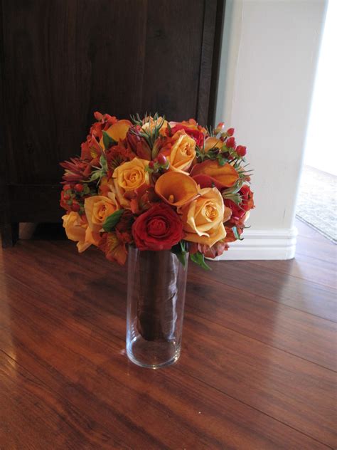 Sara's bridal bouquet, by urban chateau floral, included astilbes, maple leaves, dahlias, rice flowers, roses, baby artichokes, hypericums, and snowberry in soft shades of purple. Le Fleur Boutique: Fall Bridal Bouquet - 9/24/11
