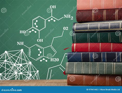 Stack Of Books Next To Blackboard With Science Diagrams Stock Photo