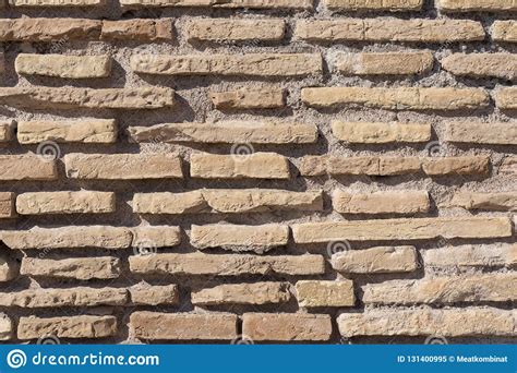 Background Of Old Dirty Brick Wall With Peeling Plaster Stock Image