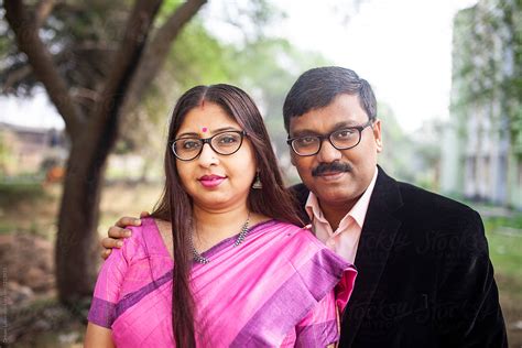 Middle Aged Indian Couple Looking At Camera By Stocksy Contributor