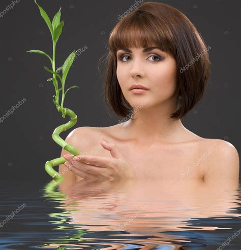 Brunette With Bamboo Stock Photo By Syda Productions