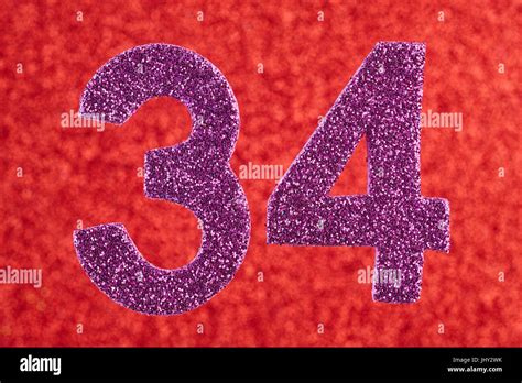 Number Thirty Four Purple Color Over A Red Background Anniversary