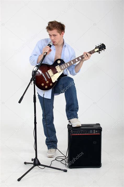 Man Playing Guitar And Singing — Stock Photo © Photography33 8101554