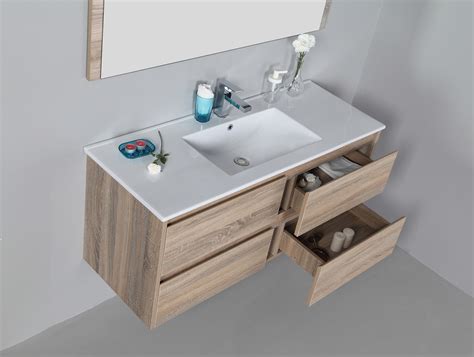 What looks like one tall washbasin as actually a white vanity drawer and a white sink on top of it. Rio 1200mm wall hung vanity with ceramic top Rio Bathroom ...