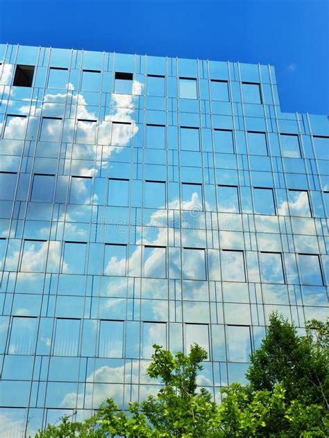 Glass Facade Of Modern Office Building With Blurred Reflections Stock