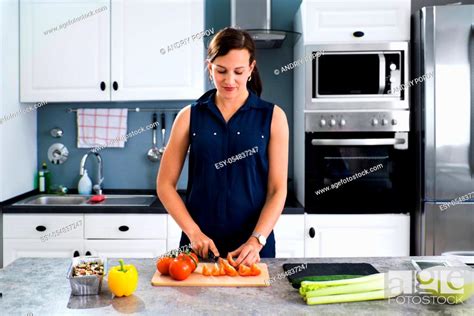 Woman Cooking Dinner At Home Cutting Vegetables Stock Photo Picture