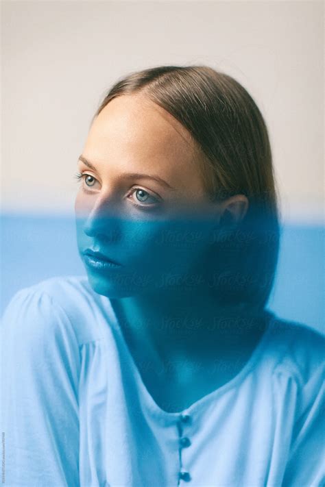 Portrait Of A Beautiful Young Woman With A Blue Color Effect By