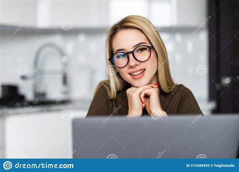 Smiling Young Woman Typing On Her Laptop In The Kitchen Stock Image Image Of Computer