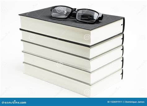 A Neatly Stacked Set Of Five Books With Reading Glasses Stock Image Image Of Books Library