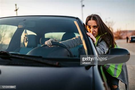Woman Pushing Car Photos And Premium High Res Pictures Getty Images