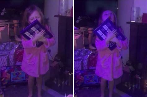 hilarious moment girl screams with delight as she opens a selection box on christmas day the