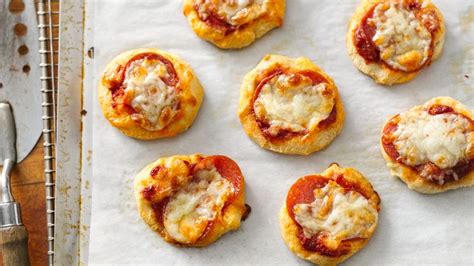 Easy crescent veggie pizza recipe from pillsbury. Flaky Biscuit Pizza Snacks Recipe - Tablespoon.com