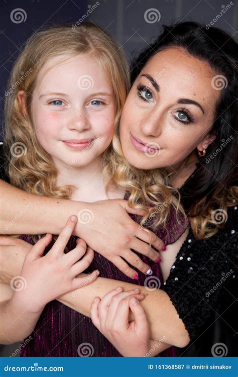 Portrait Of A Beautiful Mom And Daughter Of 10 Years Stock Image