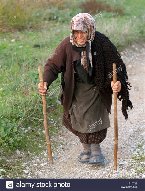 Old Lady Walking With Two Sticks Stock Photo Royalty Free Image