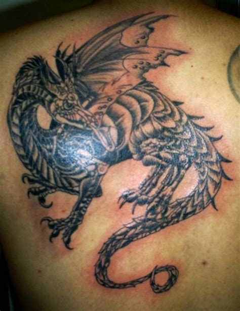 Explore cool ink ideas featuring torches of eternal glory. tattoos | Medieval Dragon tattoos | How to Tattoo