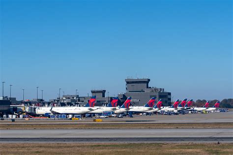 Delta Airplanes Lined Up At Terminal At Atlanta International Airport