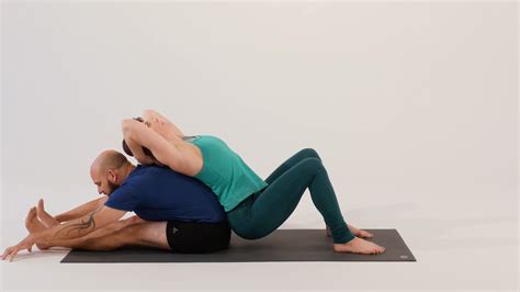 Warm Up For Your Acroyoga Session With This Seated Partner Stretch