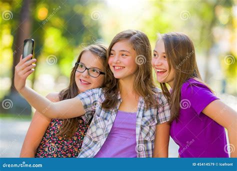 Teenage Girls Taking Selfie In Park Stock Image Image Of Girl Three