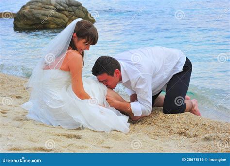 Loving Groom Kissing With Passion His Bride S Leg Stock Photo Image