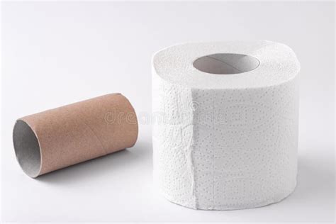 An Empty Roll Of Toilet Paper And An Entire Roll Isolated On A White