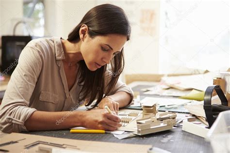 Female Architect Making Model In Office Stock Photo By ©monkeybusiness