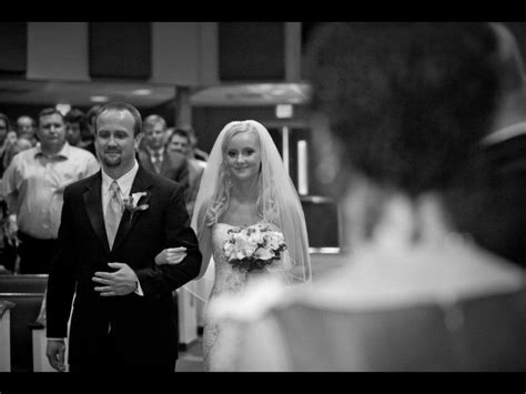 Father Walking Daughter Down The Aisle With Mother In The Foreground Wedding Wedding Dresses