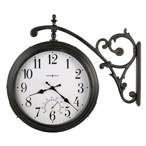 The stunning metal wall clock features a round distressed black frame and a white clock face with rust. Howard Miller Luis Vintage, Charming, Transtitional ...