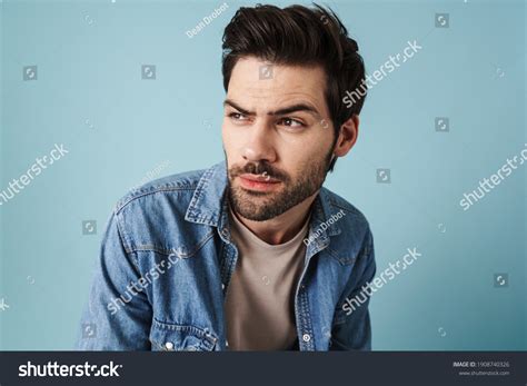 Young Handsome Brooding Guy Thinking Looking Stock Photo 1908740326