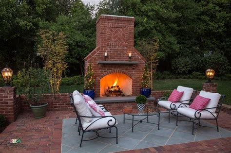 Courtyard With Gorgeous Hardscape And Fireplace Outdoor Fireplace