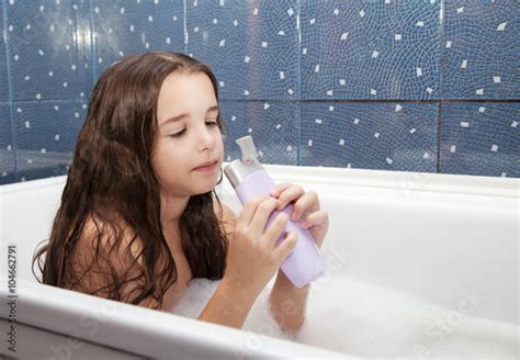 Little Girl Taking A Bath With Shampoo Buy This Stock Photo And